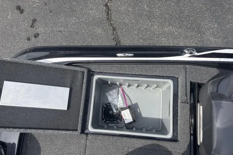 Slide: The Image of Open storage compartment in 2018 Nitro Z19 Pro boat, showing interior details and accessories. - 33