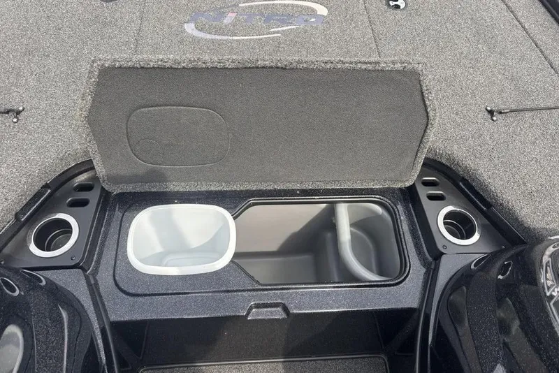 Slide: The Image of 2018 Nitro Z19 Pro boat storage compartment with cup holders and interior view. - 17