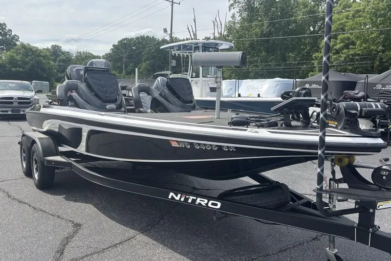 Slide: The Image of 2018 Nitro Z19 Pro bass boat on trailer, parked outdoors. - 2