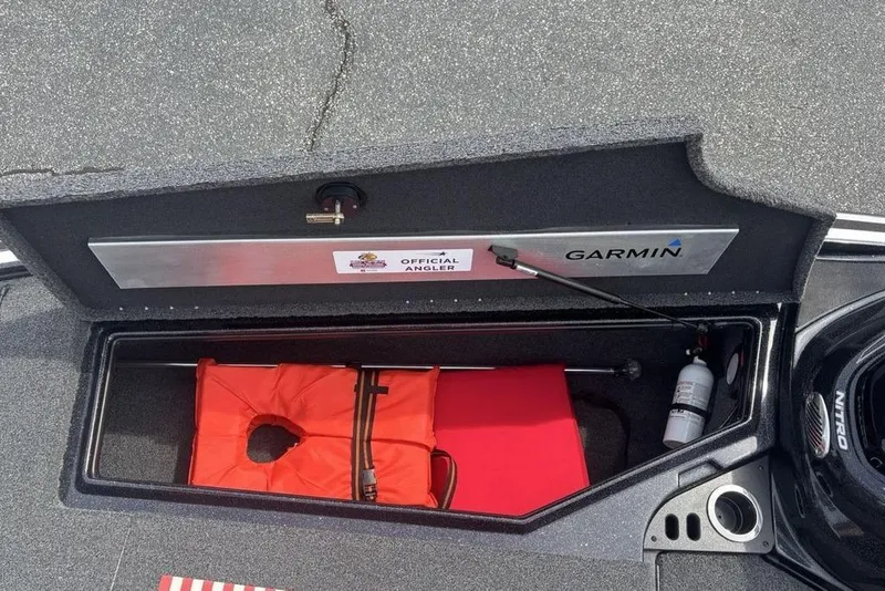 Slide: The Image of Storage compartment of a 2018 Nitro Z19 Pro boat with life jacket and fire extinguisher. - 8