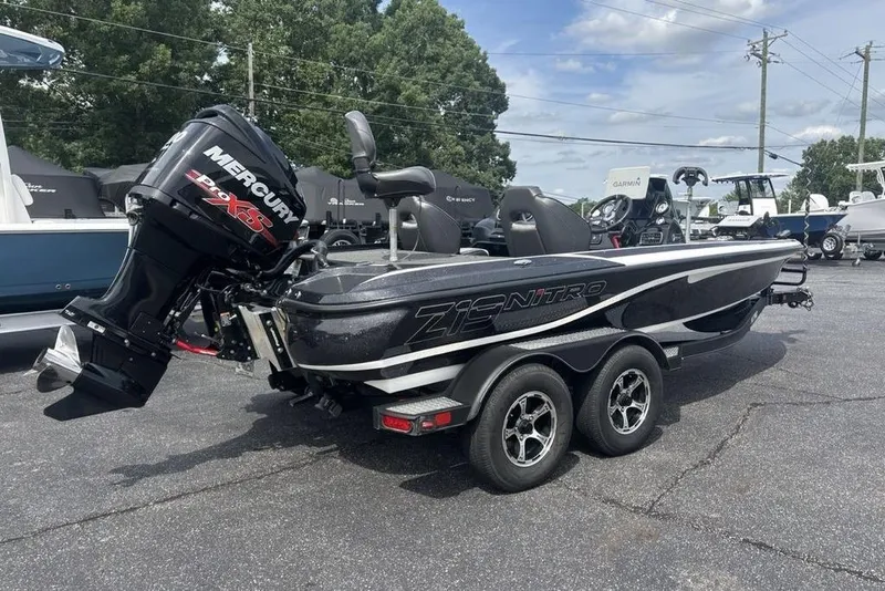 Slide: The Image of 2018 Nitro Z19 Pro boat with Mercury engine, parked on a trailer in a lot. - 3
