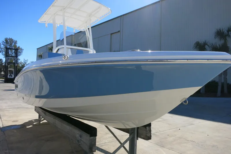 Slide: The Image of 2026 Robalo 206 Cayman boat with sleek design on display outdoors. - 4