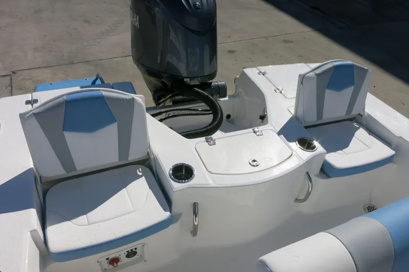 Slide: The Image of 2026 Robalo 206 Cayman boat interior with seating and motor, showcasing modern design. - 8
