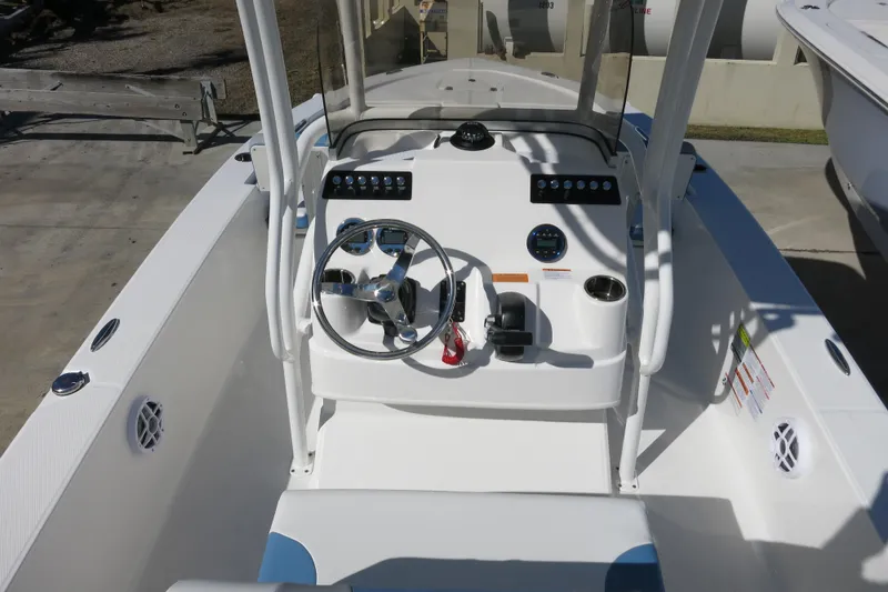 Slide: The Image of 2026 Robalo 206 Cayman boat cockpit with steering wheel and control panel. - 11