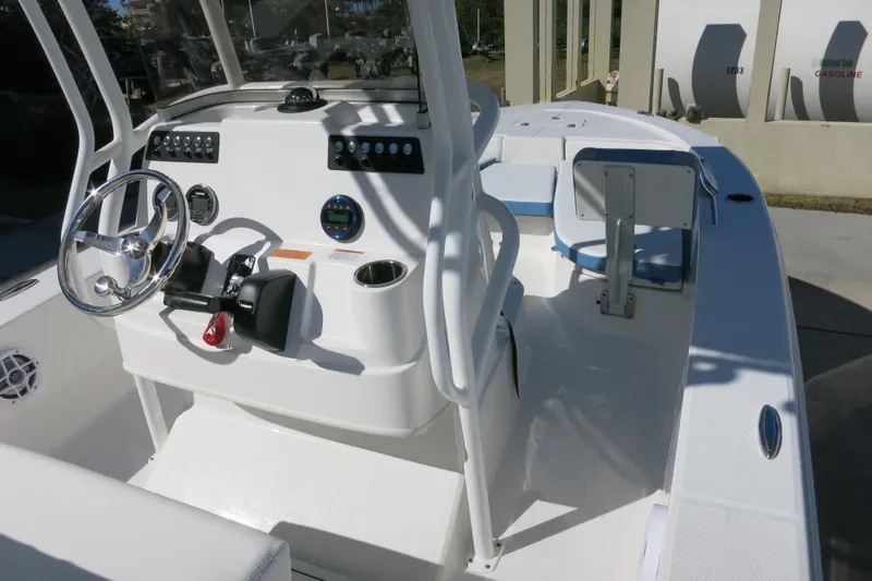 Slide: The Image of 2026 Robalo 206 Cayman boat interior with steering wheel and control panel. - 12