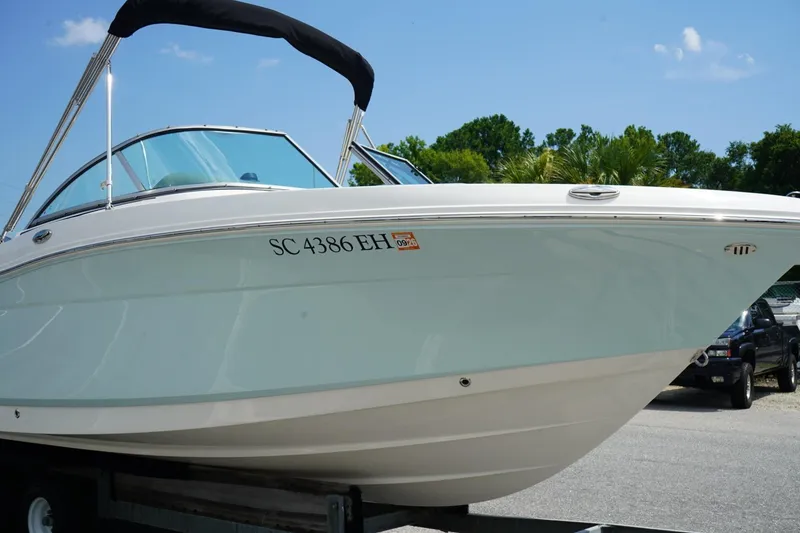 Slide: The Image of 2025 Robalo R207 Dual Console boat on trailer, sunny day, registration SC 4386 EH. - 19