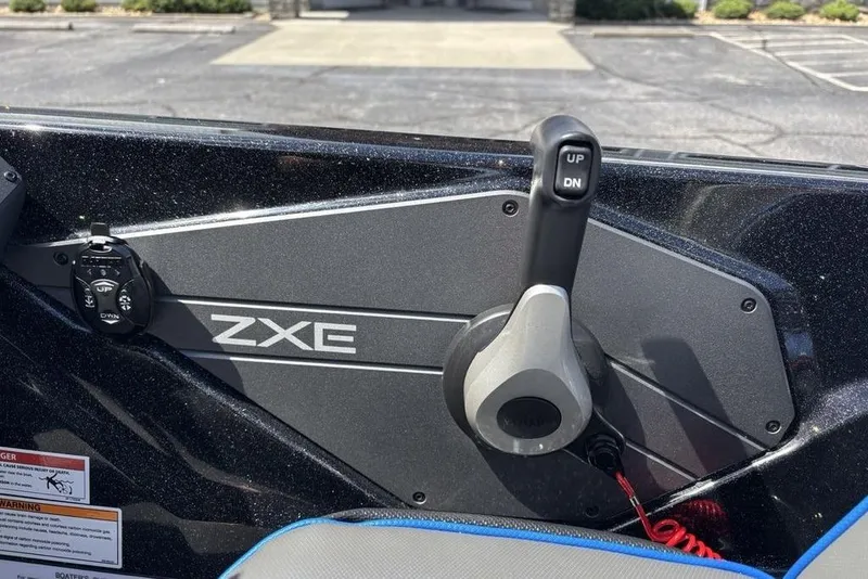Slide: The Image of Control panel of a 2026 Skeeter ZXE20 boat with throttle lever and controls. - 34