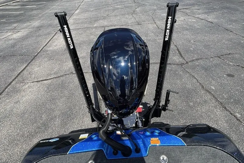 Slide: The Image of 2026 Skeeter ZXE20 boat with Minn Kota accessories on asphalt surface. - 42