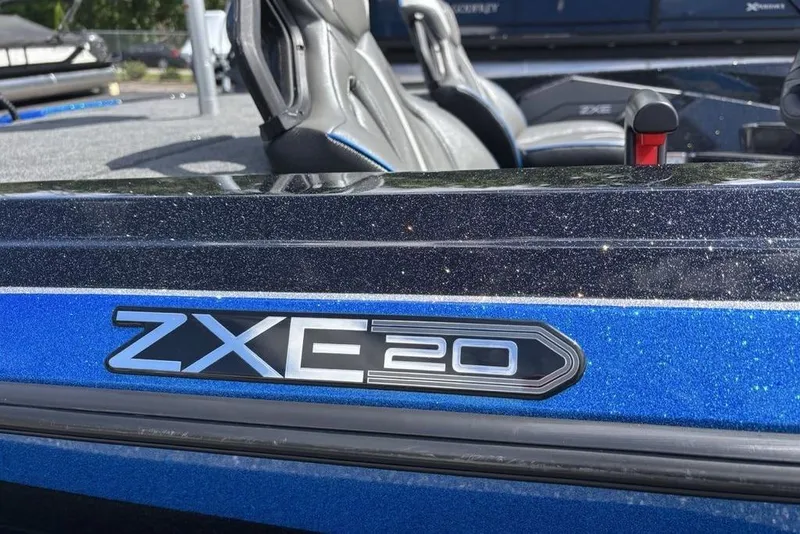 Slide: The Image of 2026 Skeeter ZXE20 boat with sleek blue and black design, featuring comfortable seating. - 50