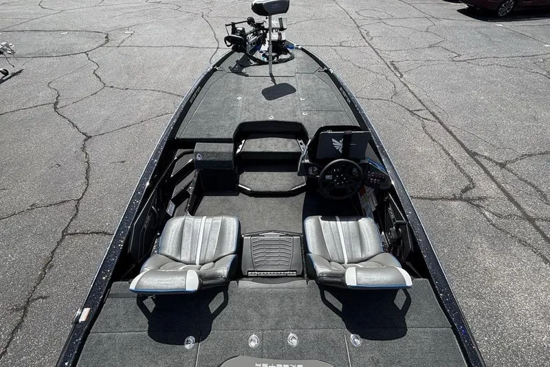 Slide: The Image of 2026 Skeeter ZXE20 boat interior with dual seats and steering console. - 47
