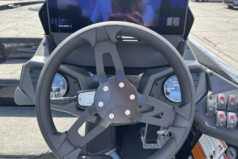 Slide: The Image of Steering wheel and dashboard of 2026 Skeeter ZXE20 boat with digital display. - 32