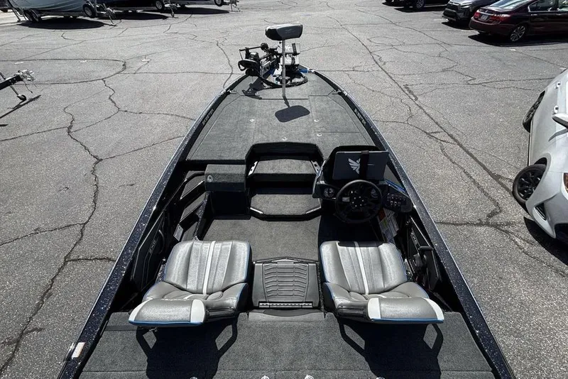 Slide: The Image of 2026 Skeeter ZXE20 fishing boat interior with dual seats and steering console. - 44