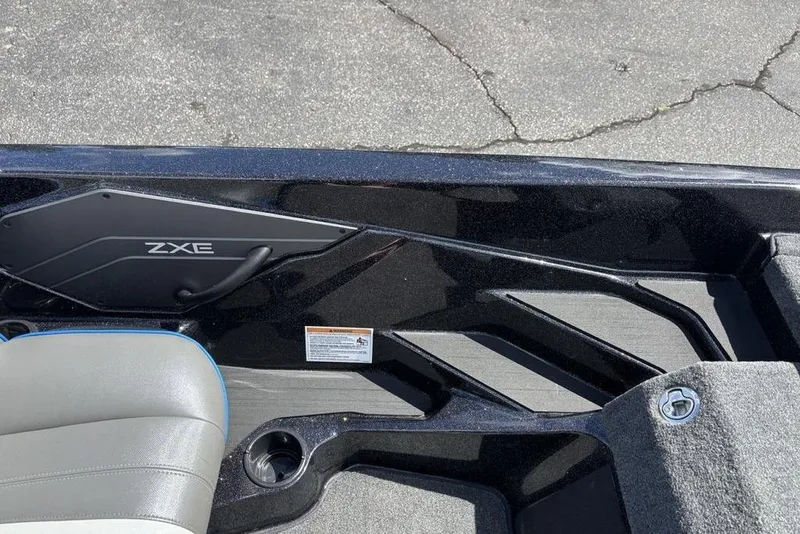 Slide: The Image of Interior view of a 2026 Skeeter ZXE20 boat, featuring sleek design and seating. - 36