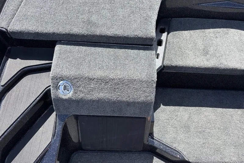 Slide: The Image of Carpeted deck of 2026 Skeeter ZXE20 boat, featuring storage compartments and sleek design. - 39