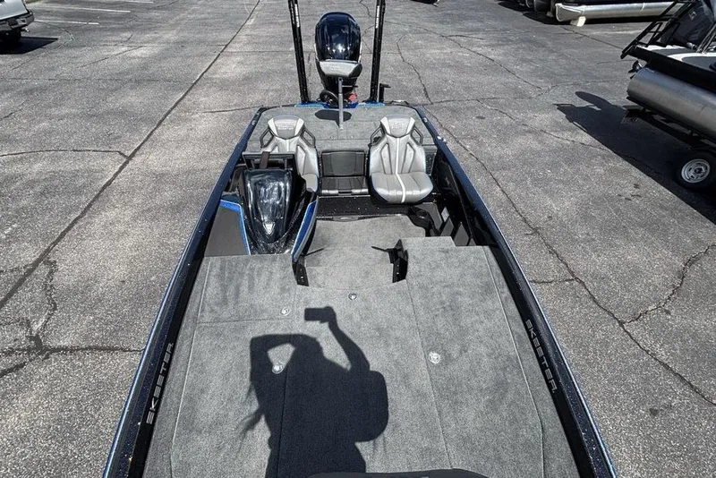 Slide: The Image of 2026 Skeeter ZXE20 boat interior with seating and carpeted deck. - 46
