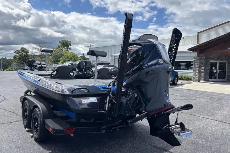 Slide: The Image of 2026 Skeeter ZXE20 boat on trailer, parked outdoors under cloudy sky. - 6