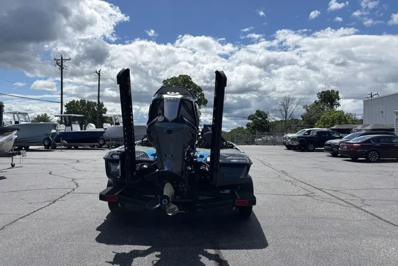 Slide: The Image of 2026 Skeeter ZXE20 boat in parking lot under cloudy sky. - 48