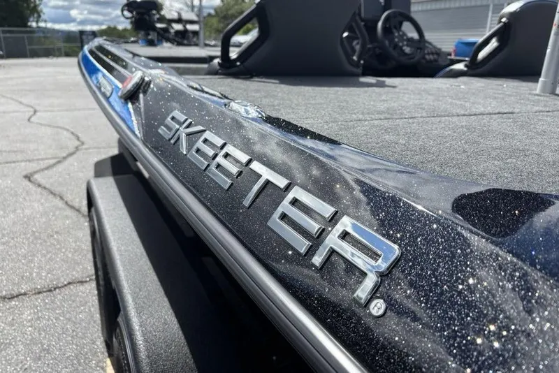 Slide: The Image of 2026 Skeeter ZXE20 boat with metallic finish, close-up view. - 8