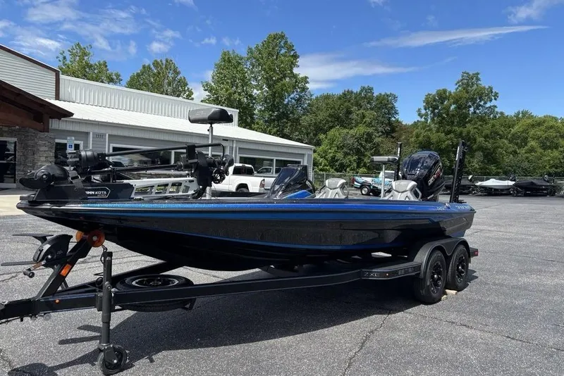 Slide: The Image of 2026 Skeeter ZXE20 boat on trailer, parked outdoors under clear sky. - 3