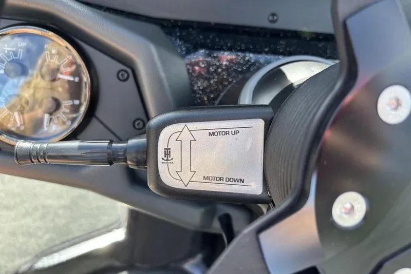Slide: The Image of Close-up of 2026 Skeeter ZXE20 boat motor control switch. - 31