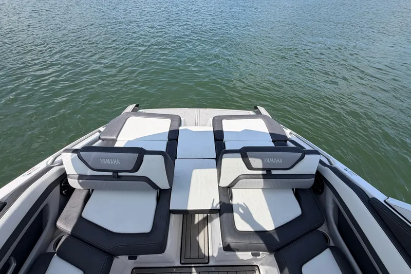 Slide: The Image of 2021 Yamaha Boats 275SD interior seating with water view. - 9