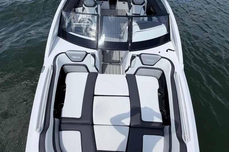 Slide: The Image of 2021 Yamaha Boats 275SD interior, featuring sleek seating and modern design on the water. - 13