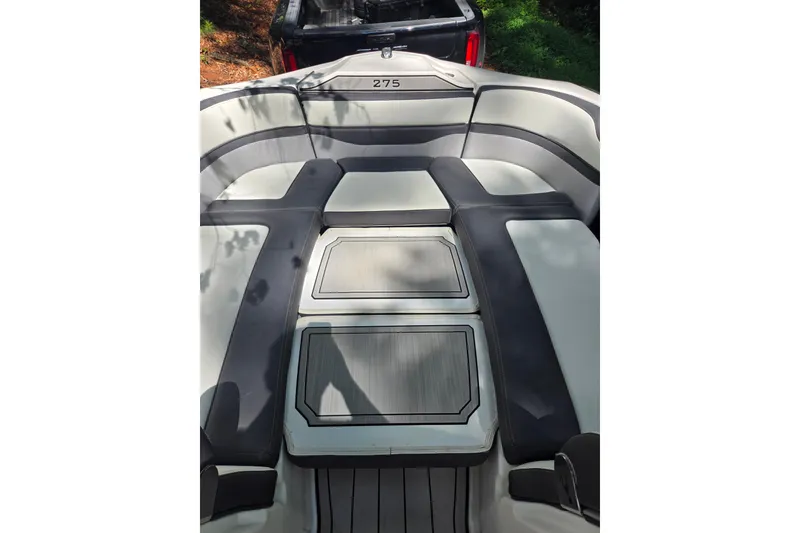Slide: The Image of 2021 Yamaha Boats 275SD interior with sleek seating and storage compartments. - 17