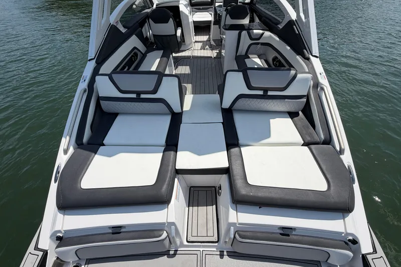 Slide: The Image of 2021 Yamaha Boats 275SD interior with luxurious seating on the water. - 10