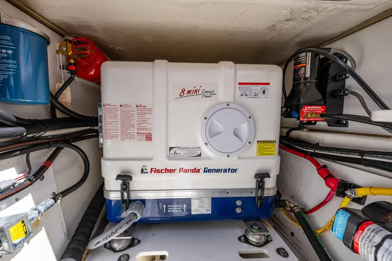 Slide: The Image of Fischer Panda generator in 2021 Pursuit OS 355 Offshore boat engine compartment. - 26