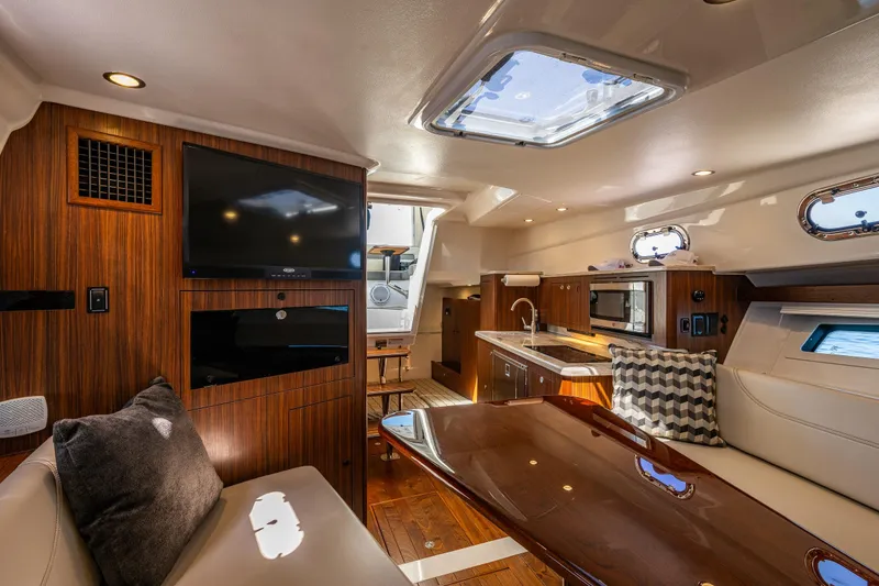 Slide: The Image of Luxurious interior of 2021 Pursuit OS 355 Offshore yacht with modern amenities and elegant design. - 10