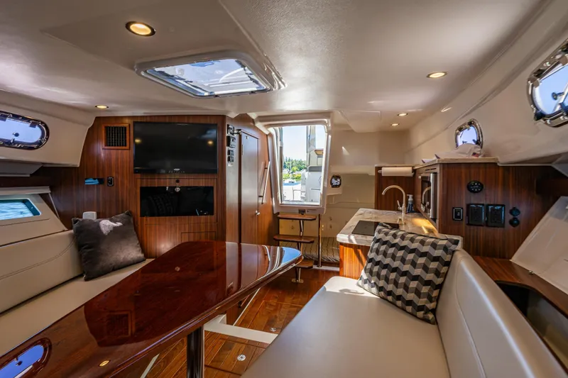 Slide: The Image of Luxurious interior of 2021 Pursuit OS 355 Offshore yacht with modern amenities and elegant design. - 11