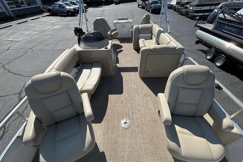 Slide: The Image of 2016 SunChaser 8525 pontoon boat with beige seating, parked in a lot. - 28