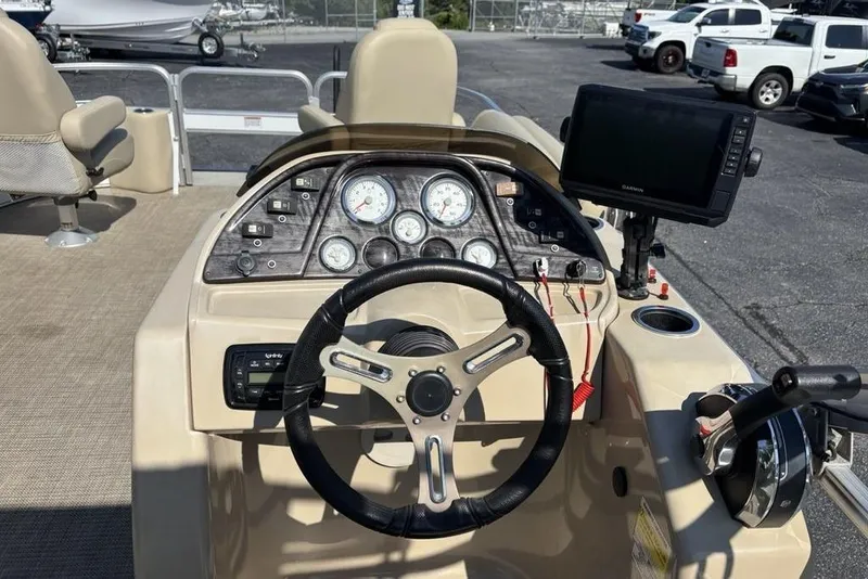 Slide: The Image of Steering console of a 2016 SunChaser 8525 boat with gauges and navigation equipment. - 14