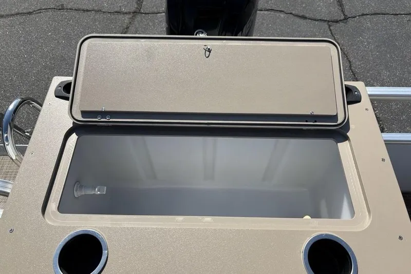 Slide: The Image of Open storage compartment on 2016 SunChaser 8525 boat with cup holders. - 17