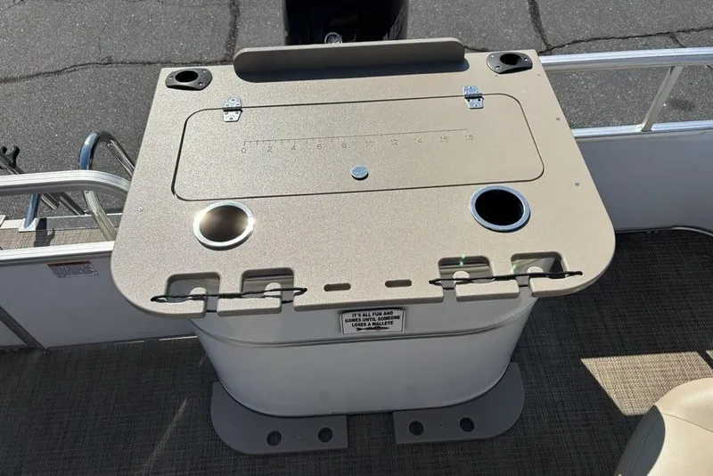 Slide: The Image of 2016 SunChaser 8525 boat console with cup holders and storage compartment. - 18