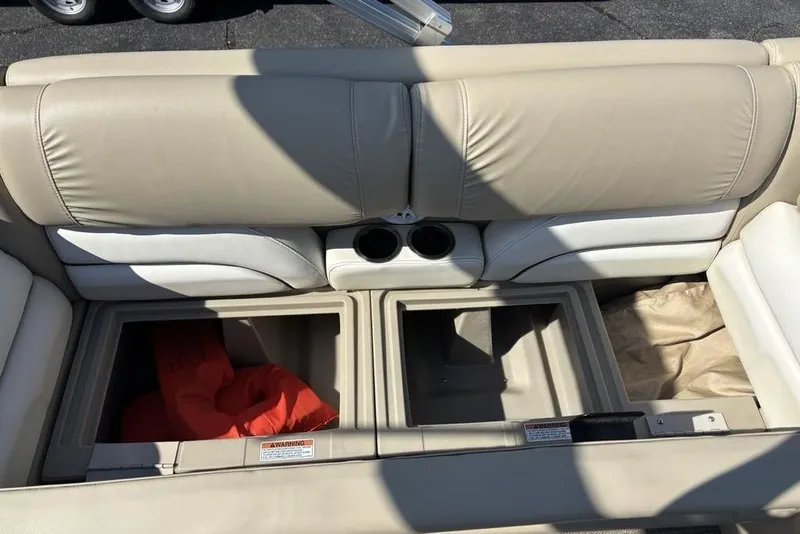 Slide: The Image of SunChaser 8525 2016 boat seat with storage compartments and cup holders. - 9