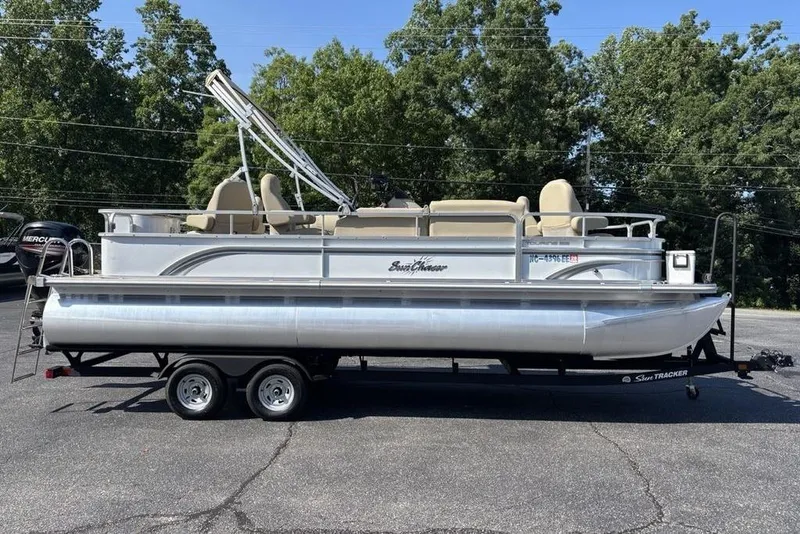 Slide: The Image of 2016 SunChaser 8525 pontoon boat on trailer, parked outdoors. - 27