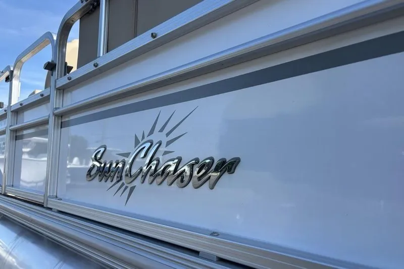 Slide: The Image of 2016 SunChaser 8525 boat with logo and sleek design details. - 5