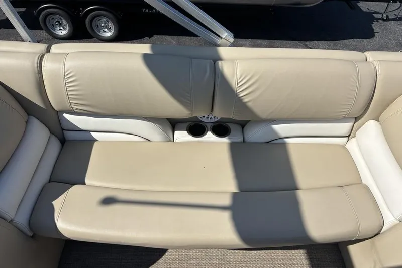 Slide: The Image of Beige leather seating on 2016 SunChaser 8525 boat with cup holders. - 8