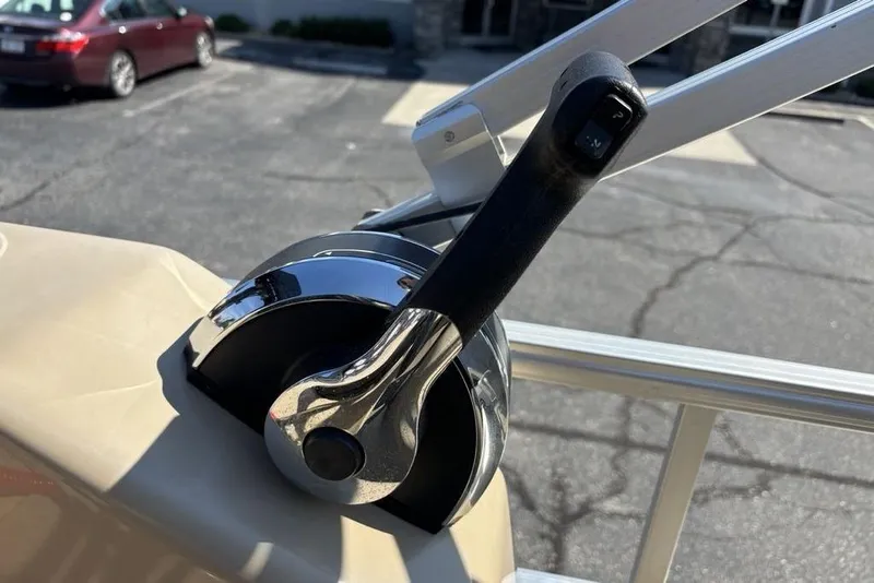 Slide: The Image of Close-up of a 2016 SunChaser 8525 boat throttle control lever in a parking lot. - 15