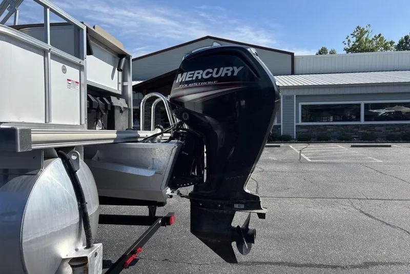 Slide: The Image of 2016 SunChaser 8525 boat with Mercury outboard motor in a parking lot. - 4