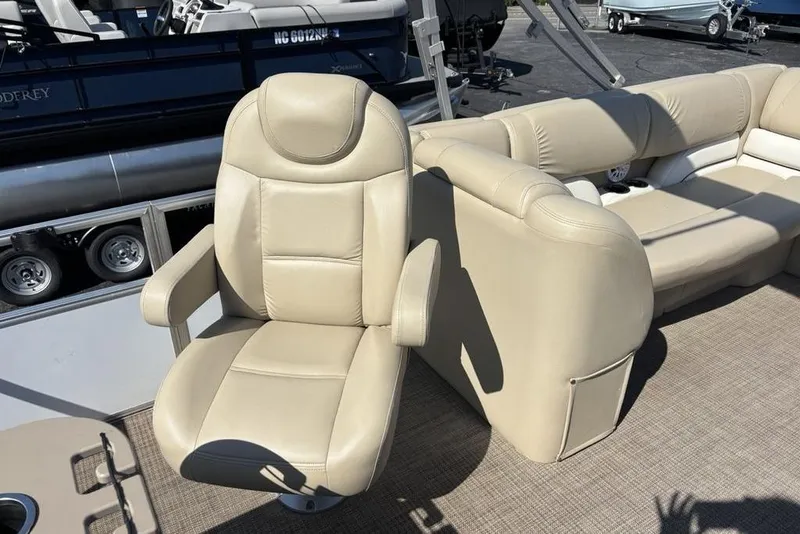 Slide: The Image of Beige seating on 2016 SunChaser 8525 pontoon boat, featuring comfortable captain's chair. - 19