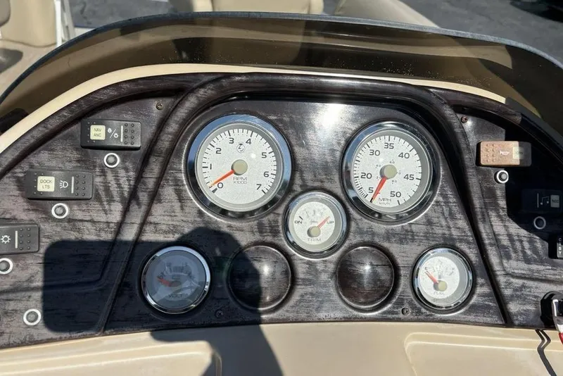Slide: The Image of Dashboard of a 2016 SunChaser 8525 boat with gauges and controls. - 12