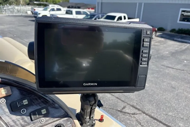 Slide: The Image of Garmin GPS device on 2016 SunChaser 8525 boat dashboard in parking lot. - 6