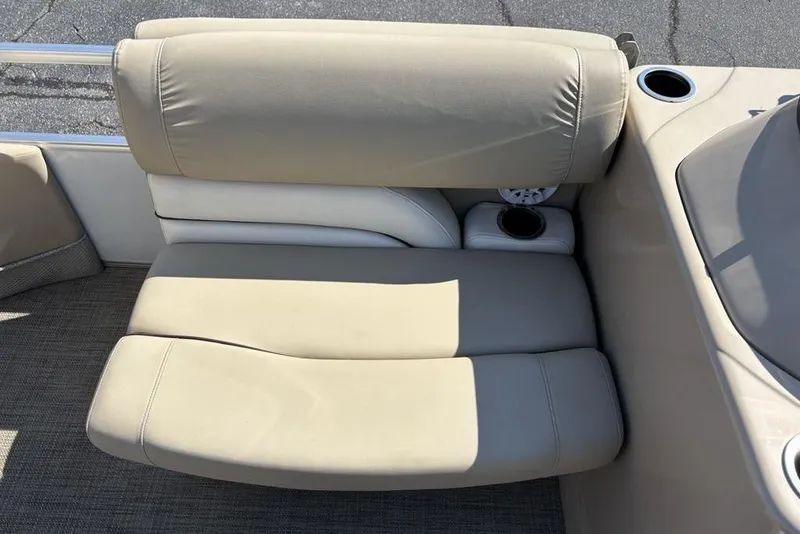 Slide: The Image of Beige seating on 2016 SunChaser 8525 boat with cup holders and textured flooring. - 13