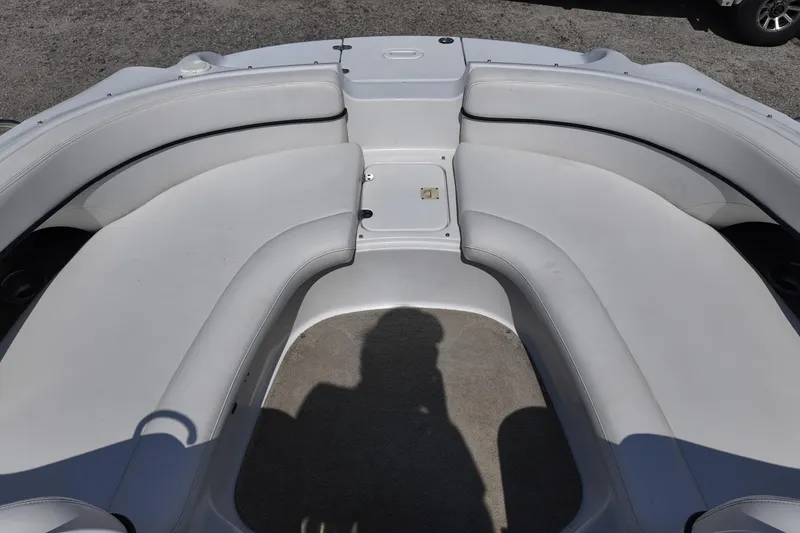 Slide: The Image of 2009 Four Winns F224 boat interior with spacious seating and clean upholstery. - 13