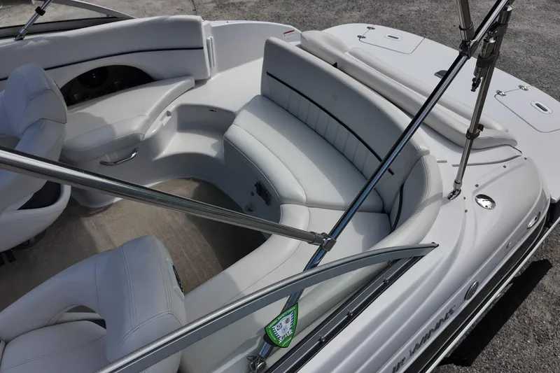 Slide: The Image of 2009 Four Winns F224 boat interior with white seating and sleek design. - 11