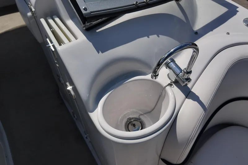 Slide: The Image of 2009 Four Winns F224 boat interior with sink and faucet detail. - 15