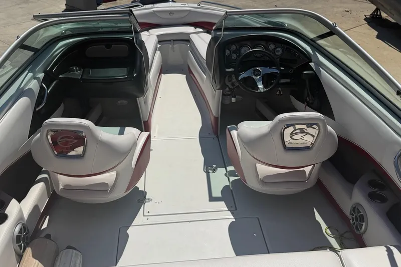 Slide: The Image of Interior view of a 2013 Crownline 21 SS boat, featuring sleek seating and dashboard. - 1