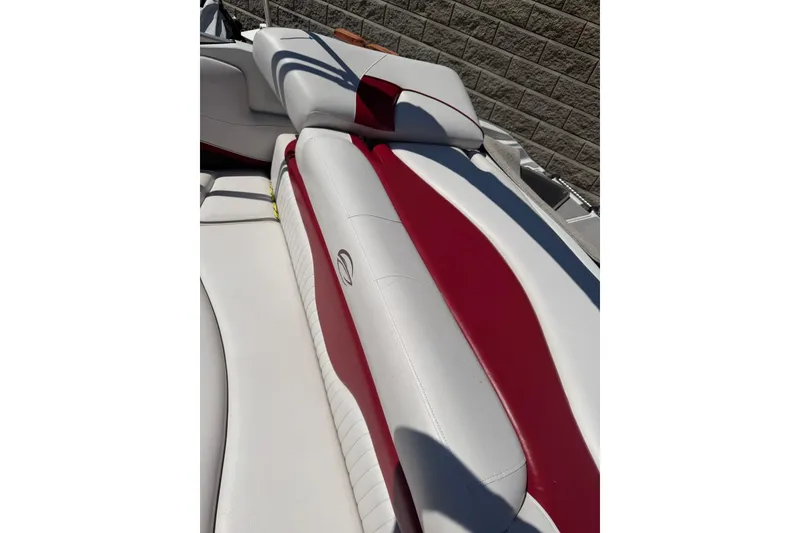 Slide: The Image of 2013 Crownline 21 SS boat interior with red and white upholstery. - 12
